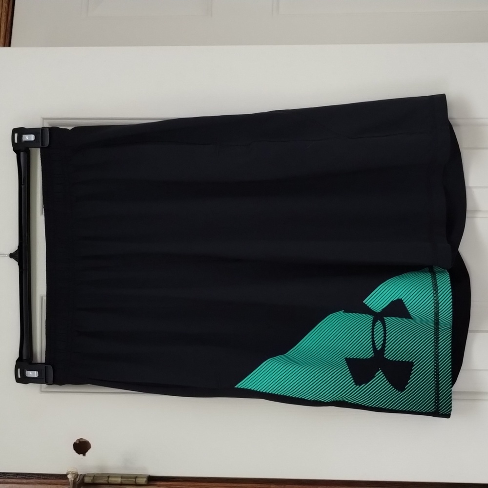 Under Armour men's dark navy shorts with  green logo, like new!